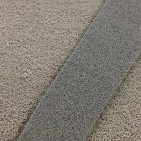 Nonwoven carpet backing